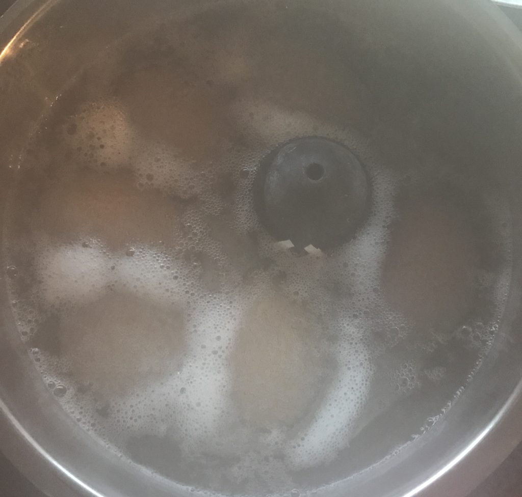 Foam pattern in a pot of boiling eggs